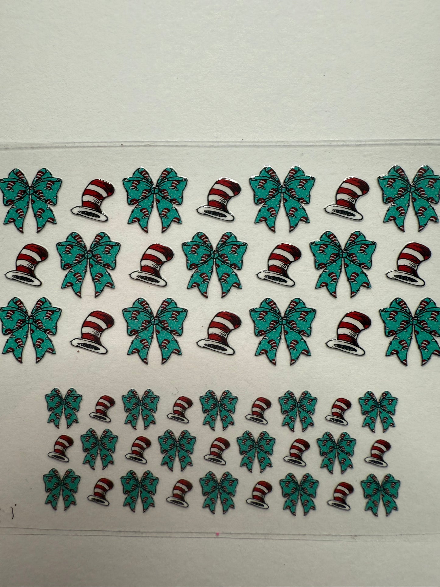 Uvdtf wraps Mini Stanley cat in the hat with teal bows